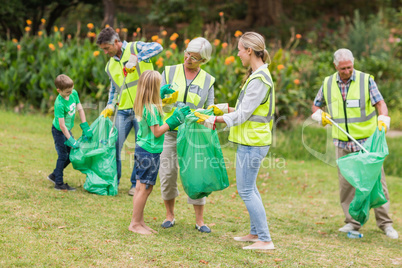 Happy family collecting rubbish