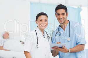 Portrait of confident doctors with arms crossed