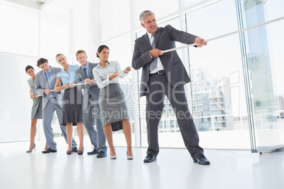 Business team pulling the rope Business team pulling the rope