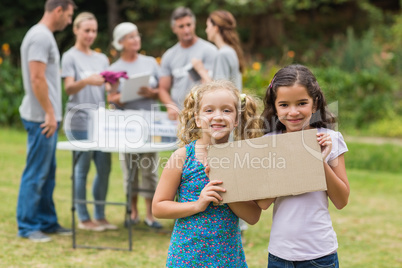 Happy children holding blank