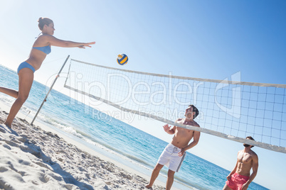 Friends playing volleyball