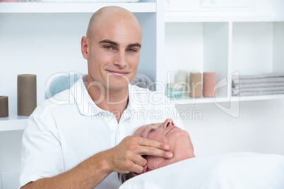 Man receiving head massage