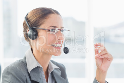 Businesswoman with headset in call centre