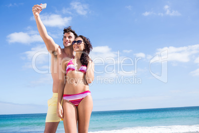 Happy couple taking selfie Happy couple taking selfie