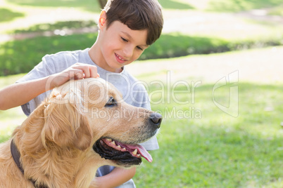 Little boy with his dog in the park