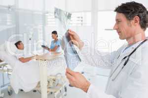 Doctor checking patients xray