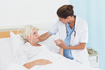 Doctor explaining report to female patient