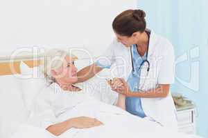 Doctor explaining report to female patient