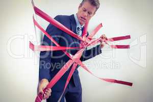 Businessman trapped by red tape