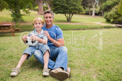 Happy father with his son at the park