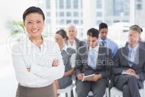 Business people looking at camera with arms crossed