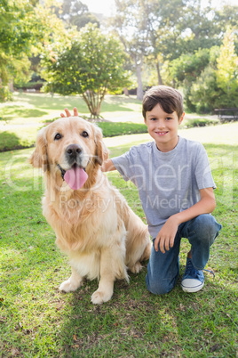 Little boy with his dog in the park
