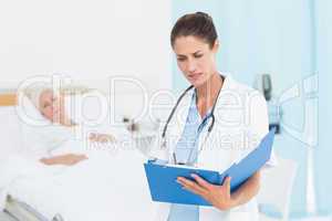 Doctor explaining report to female patient