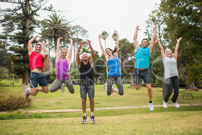 Happy athletic jumping together