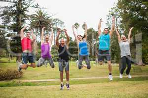 Happy athletic jumping together