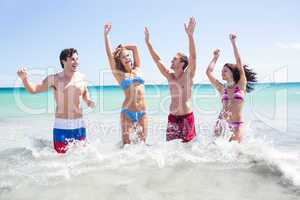 Happy friends having fun in the water together