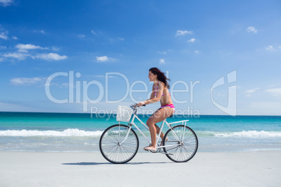 Pretty brunette going on a bike ride