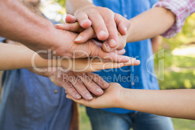 Family putting their hands together