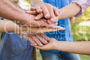 Family putting their hands together