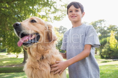 Little boy with his dog in the park