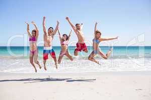 Happy friends jumping together