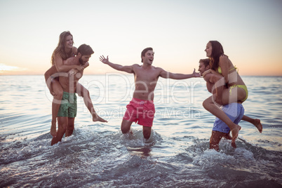 Happy friends having fun in the water