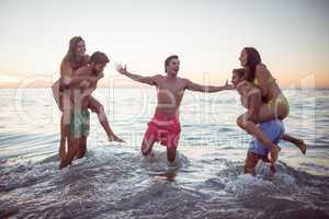 Happy friends having fun in the water