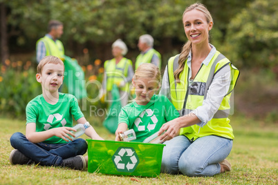 Happy family collecting rubbish