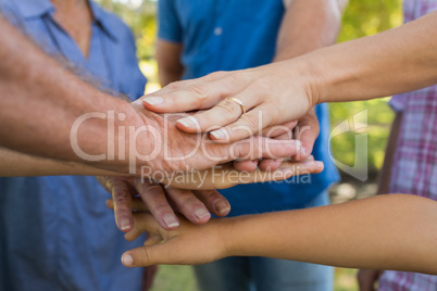 Family putting their hands together