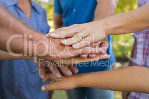 Family putting their hands together