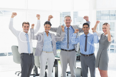 Business people cheering in office