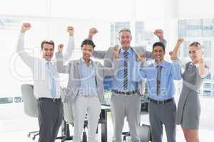 Business people cheering in office