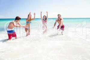 Happy friends having fun in the water together