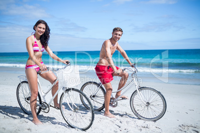 Happy couple going on a bike ride