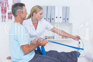 Doctor examining her patient back legs