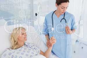 Doctor checking her patients heartbeat