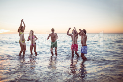 Happy friends having fun in the water