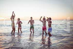 Happy friends having fun in the water