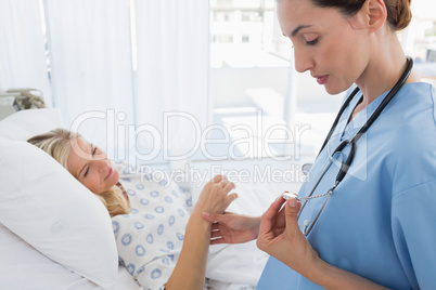 Doctor checking her patients heartbeat