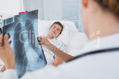 Doctors examining patients xray