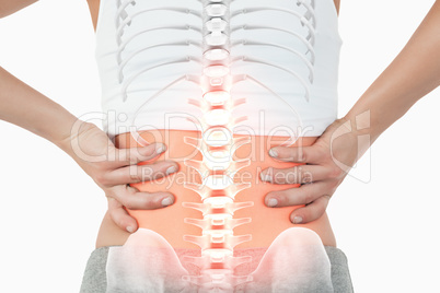 Highlighted spine of woman with back pain