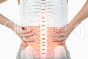 Highlighted spine of woman with back pain