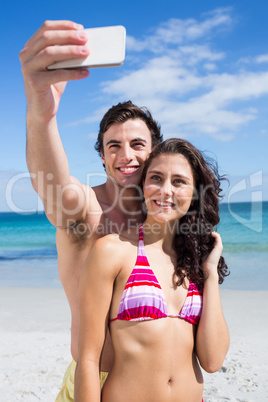 Happy couple taking selfie Happy couple taking selfie
