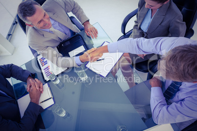 Business team shaking hands at meeting