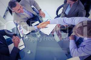 Business team shaking hands at meeting