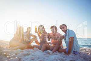 Happy hipsters relaxing and drinking beer