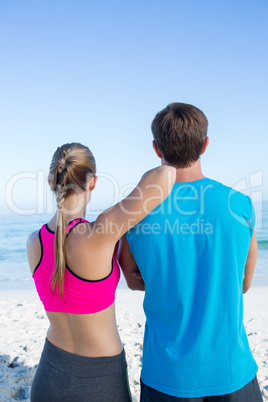 Happy couple looking at the sea