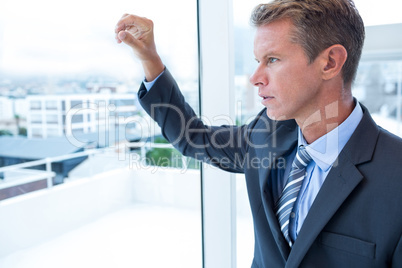 Businessman looking out the window