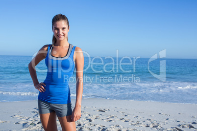 Smiling fit woman looking at camera