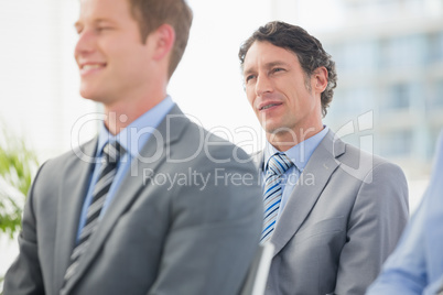 Businessmen listening conference presentation Businessmen listening conference presentation